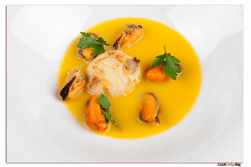 Creamy Seafood Soup with Scallops, Mussels and White Garlic.